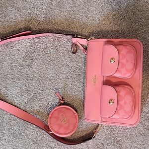pink coach bag with attached coin purse.